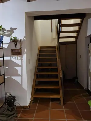 a set of stairs leading up to a room at Cabañas Casa Flor Yacanto in Villa Yacanto