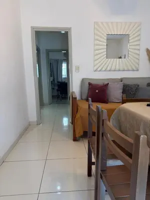 a bedroom with a bed and a mirror on the wall at CASA Q Cba Zona Norte Kempes Aeropuerto Shopping cochera asador patio full equipada confortable in Cordoba