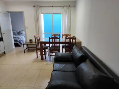 a living room with a couch and a dining room table at Velez Dpto in Río Tercero