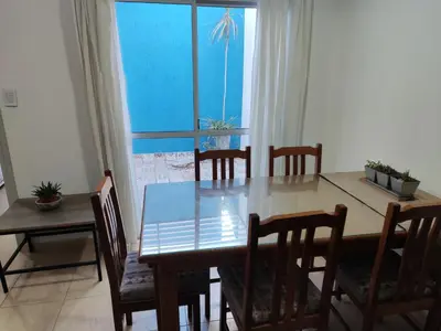 a dining room with a table and chairs and a window at Velez Dpto in Río Tercero