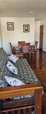 a bedroom with two beds and a table and chairs at Departamento -Córdoba Capital- zona Centro in Cordoba