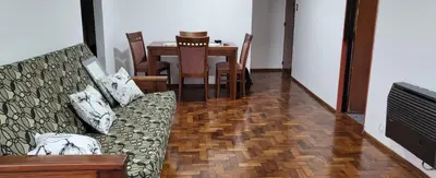 a living room with a couch and a dining room table at Departamento -Córdoba Capital- zona Centro in Cordoba