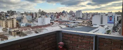 a view of a city from a brick wall at Departamento -Córdoba Capital- zona Centro in Cordoba