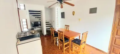 a kitchen with a table and chairs and a stove at La Casona in Cordoba