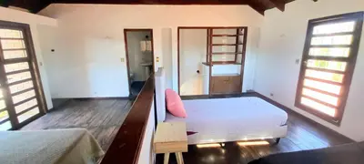 a bedroom with two beds and two windows at La Casona in Cordoba