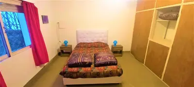 a bedroom with a bed in a room at La Casona in Cordoba