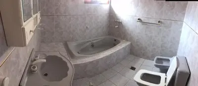 a bathroom with a tub and a toilet and a sink at La Casona in Cordoba