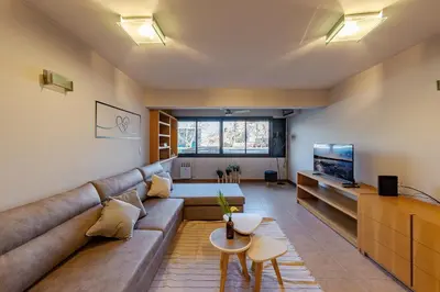 a living room with a couch and a television at Departamento Centrico en Villa Carlos Paz in Villa Carlos Paz