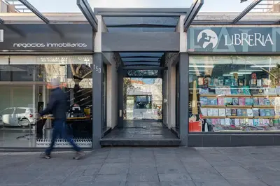 a person walking in front of a store at Departamento Centrico en Villa Carlos Paz in Villa Carlos Paz