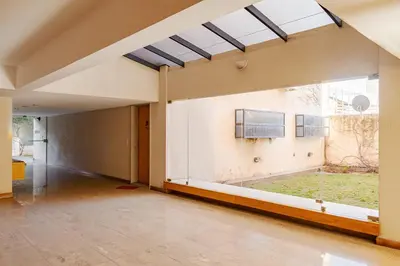 an empty room with a large window in a house at Departamento Centrico en Villa Carlos Paz in Villa Carlos Paz
