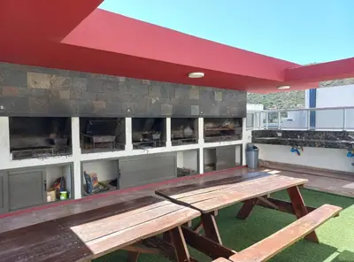 a picnic table on the roof of a building at Sommet I in Villa Carlos Paz