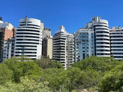 a group of tall buildings in a city at Balcarce Deluxe in Cordoba