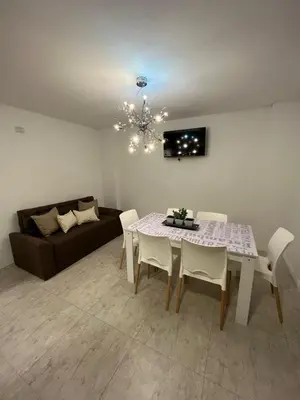 a living room with a table and a couch at Carlos Paz-Lake Towers in Villa Carlos Paz