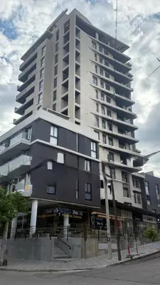 a large building on the corner of a street at Carlos Paz-Lake Towers in Villa Carlos Paz