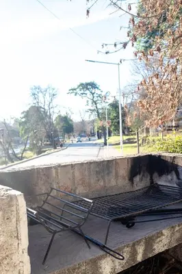 a chair sitting on top of a concrete wall at Jazmines Departamentos in Santa Rosa de Calamuchita
