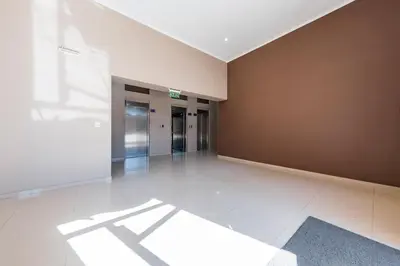 an empty hallway with an elevator in a building at Un Rinconcito en Guemes - Confort y Calidez in Cordoba
