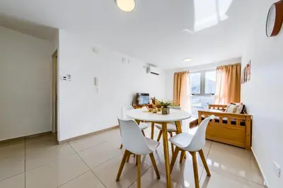 a kitchen and dining room with a table and chairs at Un Rinconcito en Guemes - Confort y Calidez in Cordoba