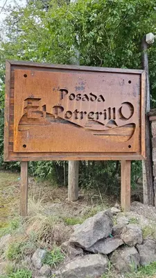 a sign that says pasadena patriculum on it at El Potrerillo Posada in Santa Rosa de Calamuchita