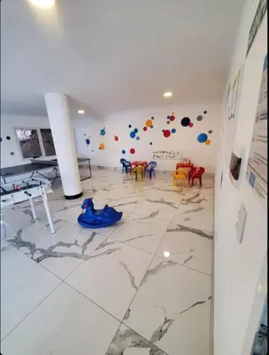 a room with a painting on the wall of a room at Departamento Veneto Village - D - in Villa Parque Siquiman