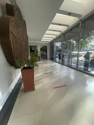 a empty lobby with a potted plant in a building at Coral State in Cordoba