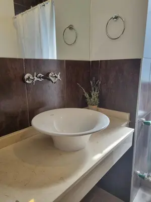 a bathroom with a white sink on a counter at PRISMA CUARENTA in Villa Carlos Paz
