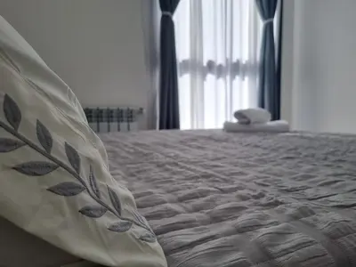 a close up of a bed in a bedroom at PRISMA CUARENTA in Villa Carlos Paz