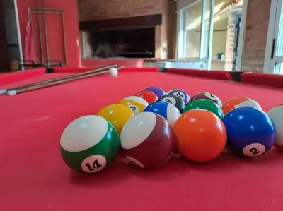 a group of balls on a pool table at Casa La Nona 5 personas con patio y quincho in Cordoba