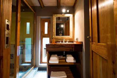 a bathroom with a sink and a mirror at Puesto Victoria - Adults only in Yacanto