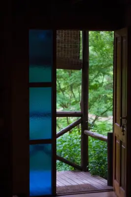 an open door with a view of a forest at Puesto Victoria - Adults only in Yacanto