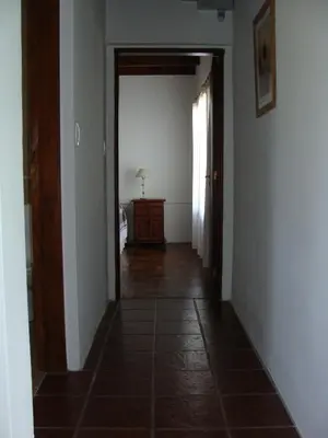 an empty hallway with a hallway leading to a bedroom at Vista del Condor in Villa Ciudad de America
