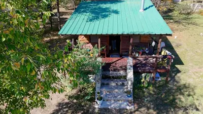 an overhead view of a small house with a green roof at NOMADE cabin rent in San Antonio de Arredondo
