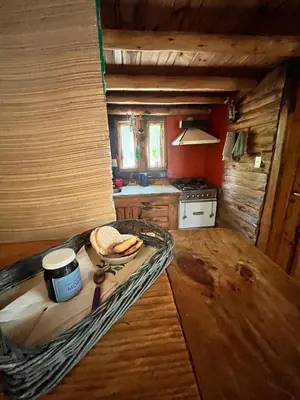 a kitchen with a table with a sandwich on it at NOMADE cabin rent in San Antonio de Arredondo