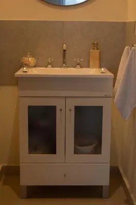 a bathroom with a sink and a white cabinet at Complejo Moras I in Almafuerte