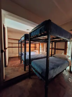 a bedroom with two bunk beds in a room at Why Not Guemes in Cordoba