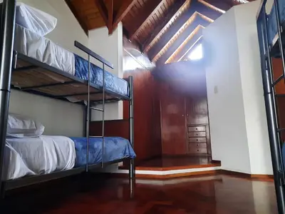 a room with two bunk beds and a hallway at Why Not Guemes in Cordoba