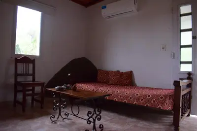 a living room with a couch and a table at Casa en Cabalango in Cavalango