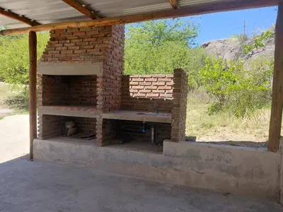 an outdoor brick oven is under a roof at Casa en Cabalango in Cavalango