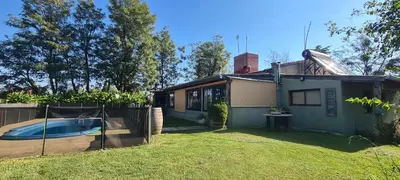 a house with a swimming pool in a yard at Casa de campo boutique a 18 minutos de Merlo in Cortaderas