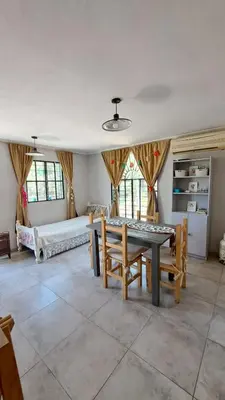 a dining room with a table and chairs in it at La aurora in Pantanillo