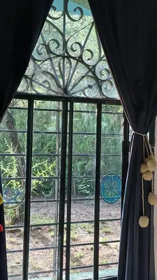 a window with a view of a garden outside at La aurora in Pantanillo