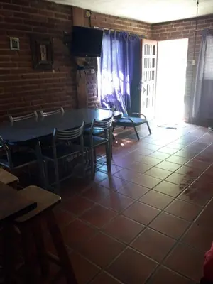a dining room with a table and chairs at Ojos de cielo Monoambientes para 2 y 3 personas in Bialet Massé