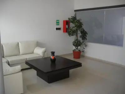 a living room with a couch and a coffee table at Village Tower in Villa Carlos Paz