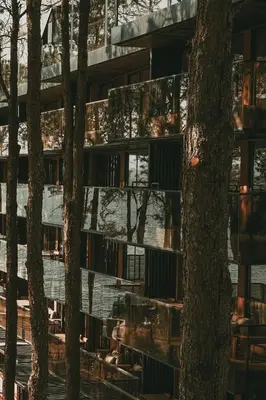 a building with trees in front of it at Get Hotel Molvento, AKEN SOUL Collection in Villa General Belgrano