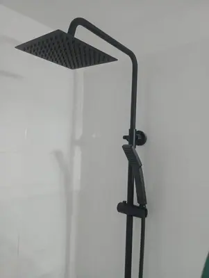 a black desk lamp in front of a window at La casa de Emma in Cordoba