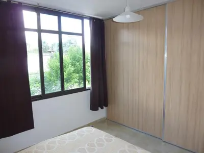 a bedroom with a bed and a window at Dúplex El Ceibo in Villa Carlos Paz