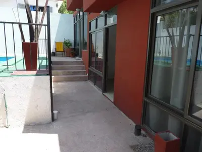 a hallway of a building with a glass door at Dúplex El Ceibo in Villa Carlos Paz