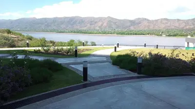 a view of a lake with mountains in the background at Departamento Veneto Village, Parque Siquiman, Carlos Paz in Villa Parque Siquiman