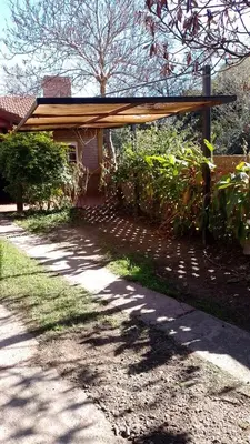 a building with awning on the side of a road at Aparts Altos del Centro in Merlo