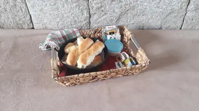 a basket filled with bread and medicines on a couch at Dos Soles in Mina Clavero