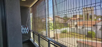 a large window with a view of a yard at La Palmerita 9 in Villa Carlos Paz